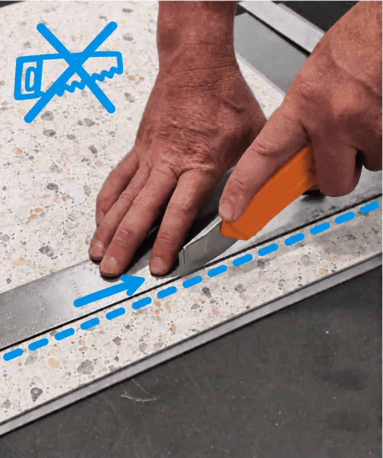 Scoring and snapping a Floorious wall panel with a utility knife